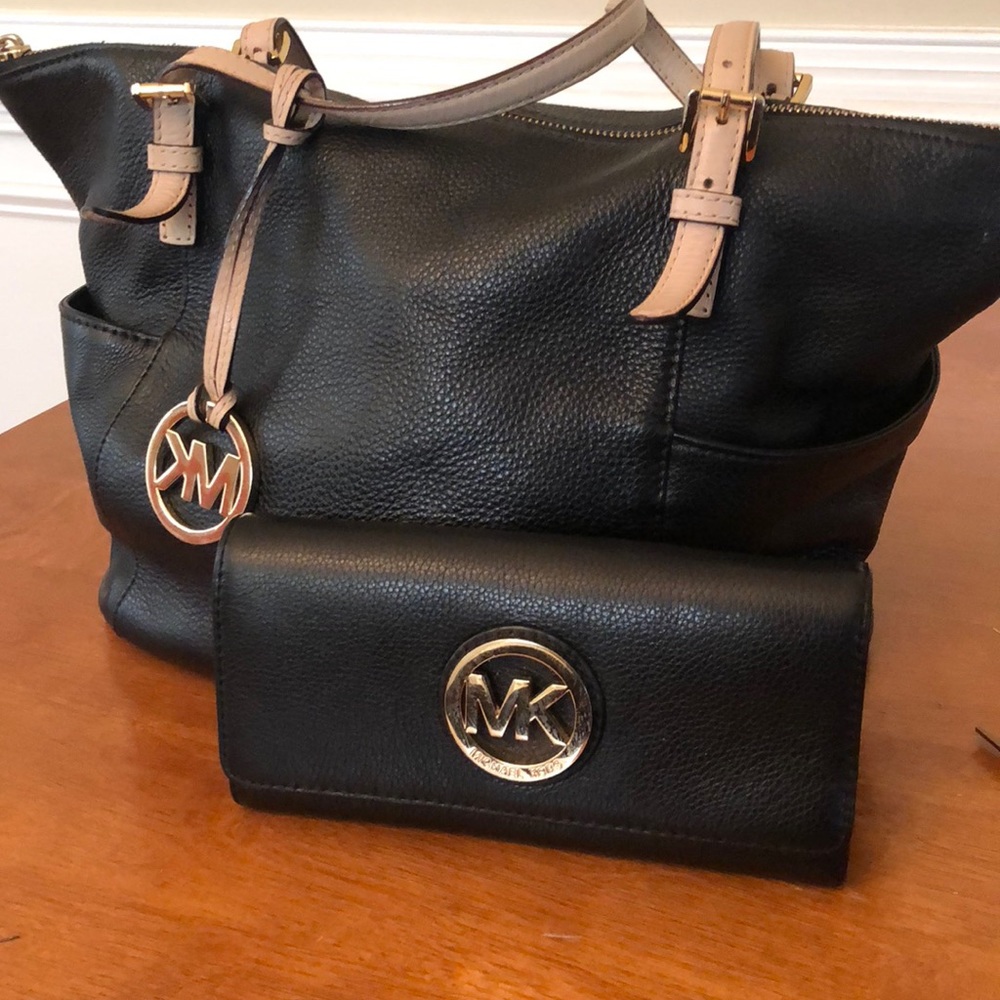 Women Black and Tan Michael Kors purse and wallet